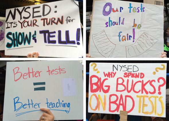 Signs held at a demonstration at public school PS3 on April 11, 2014.