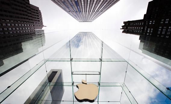 The Apple logo hangs in a glass enclosure above the 5th Ave Apple Store in New York, September 20, 2012.