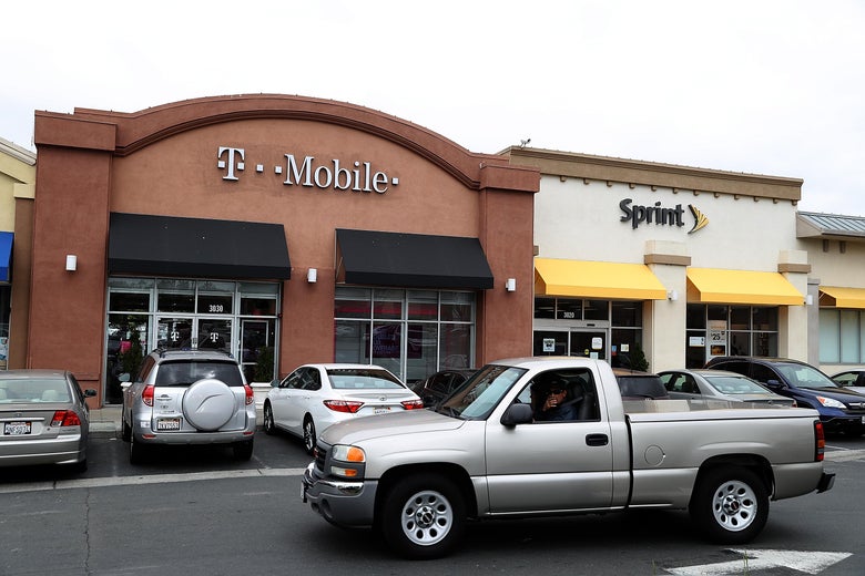 EL CERRITO, CA - APRIL 30:  A T-Mobile and Sprint store sit side-by-side in a strip mall on April 30, 2018 in El Cerrito, California. T-Mobile announced plans to acquire Sprint for $26 billion to merge the two telecom companies.  (Photo by Justin Sullivan/Getty Images)
