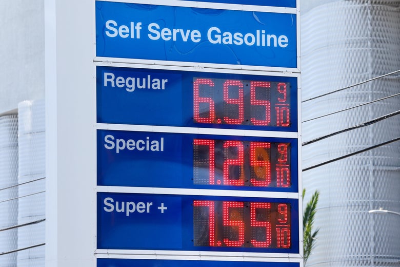 A sign displays gas prices of $6.95 for regular, $7.25 for special, and $7.55 for super plus