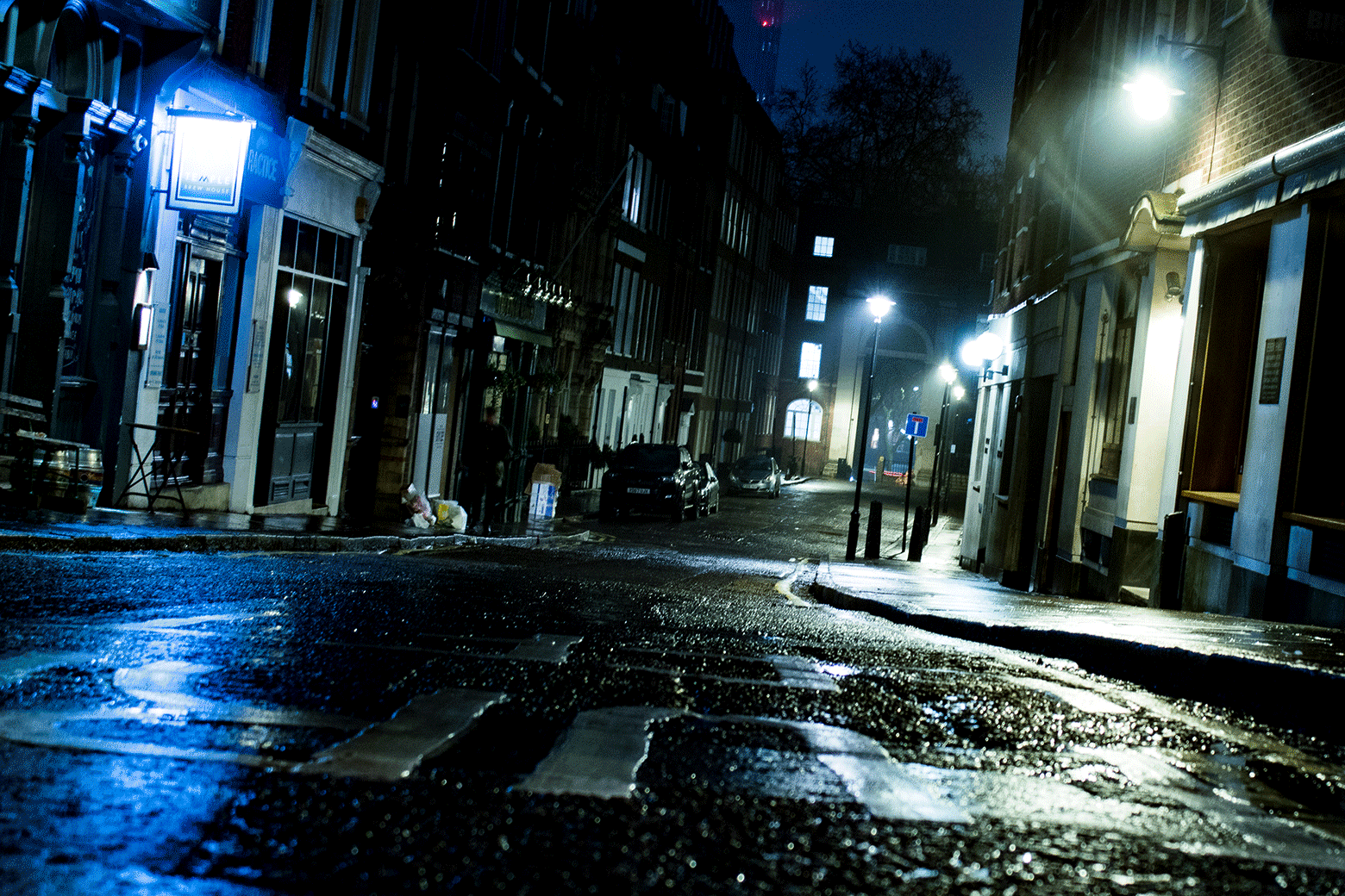 A lamppost glitching on a dark London street.
