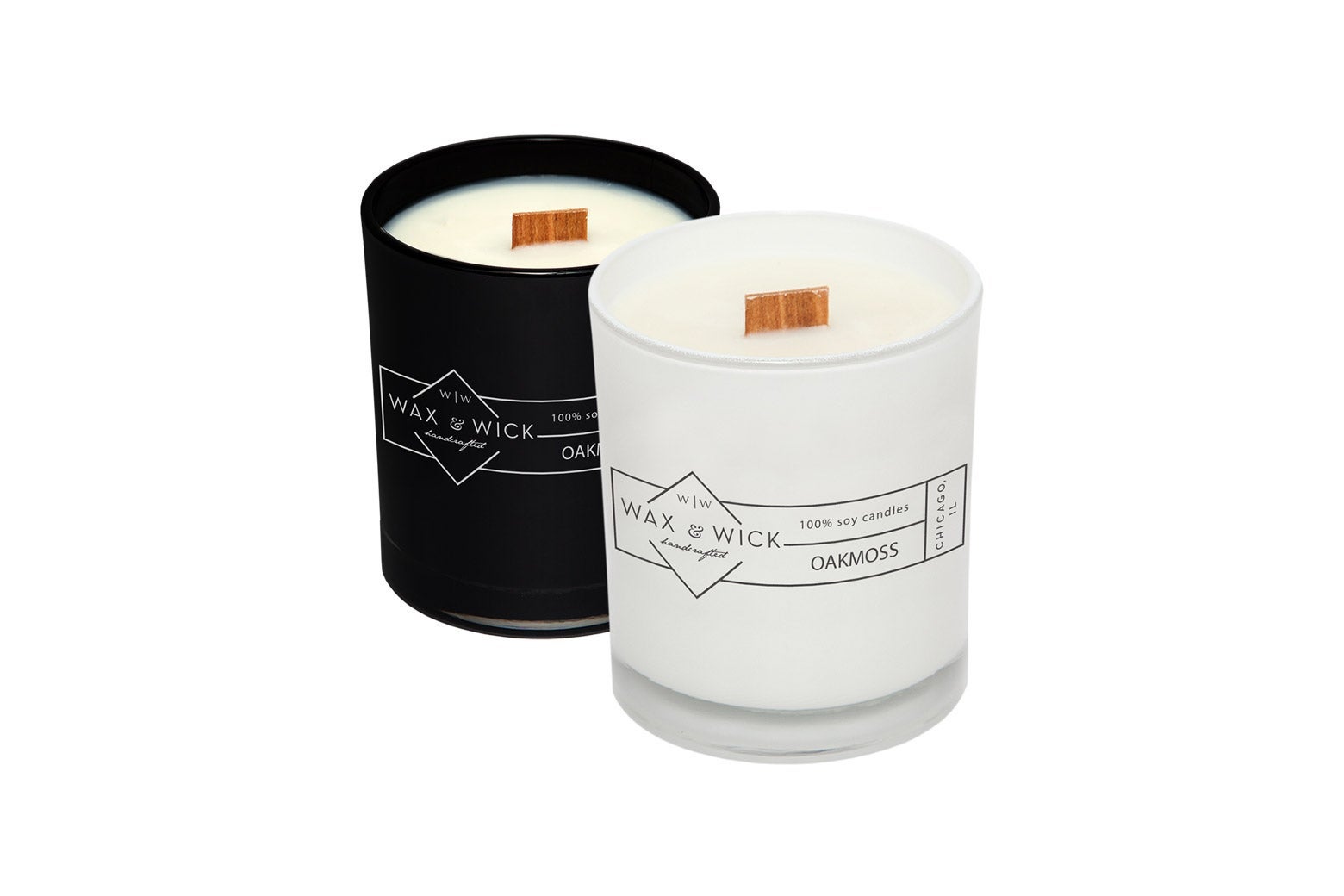 Two Wax and Wick candles, one in a black jar, one in a white jar.
