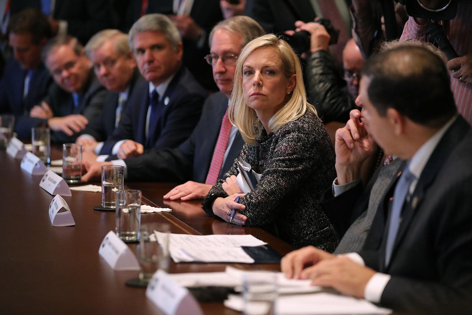 Homeland Security Secretary Kristjen Nielsen joins President Donald Trump and Republican and Democrat members of Congress for a meeting on immigration on Tuesday in Washington.
