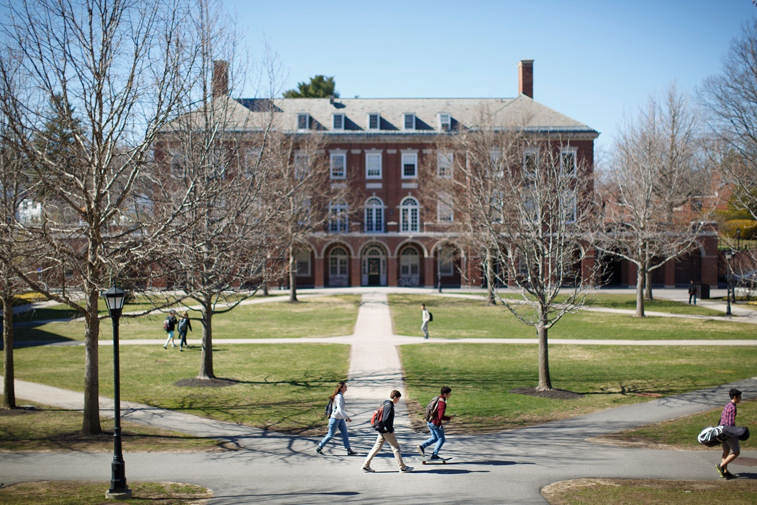 Students walk on paths that stretch out in front of Phillips Exeter Academy.