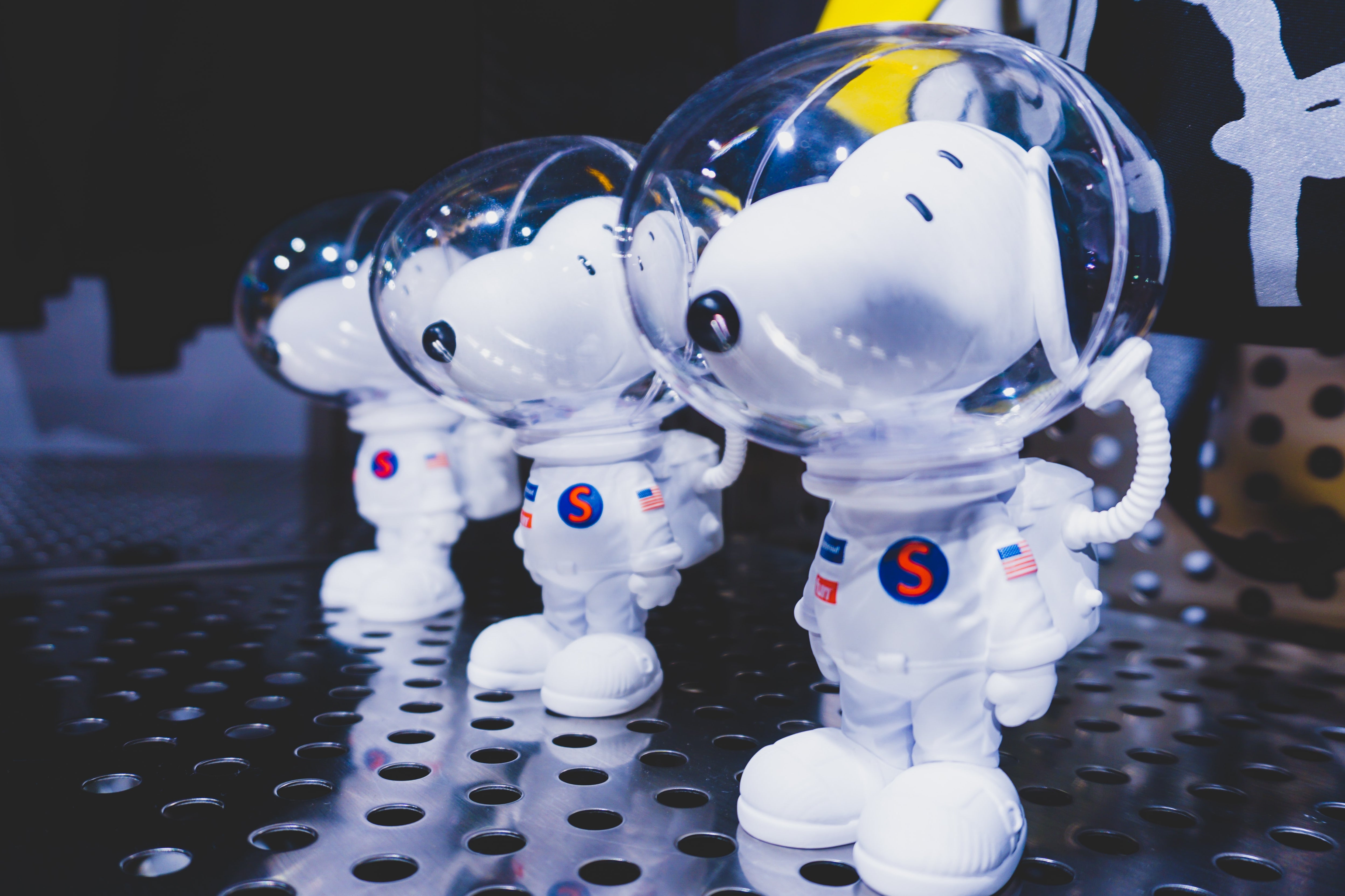 Snoopy wearing a spacesuit—actually, three Snoopies. 