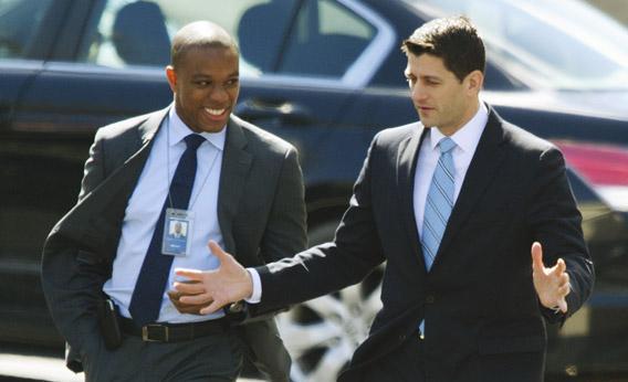 House Budget Committee Chairman Paul Ryan (R) is escorted to the West Wing on March 7, 2013 for a lunch with US President Barack Obama at the White House in Washington, DC. 