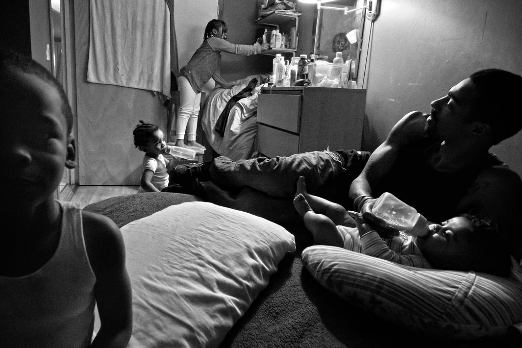 Bronx, NY. 2012. Guy Miller keeps a watchful eye on his children Nijeyah, Nijel, Guy Jr., and Lanae. 