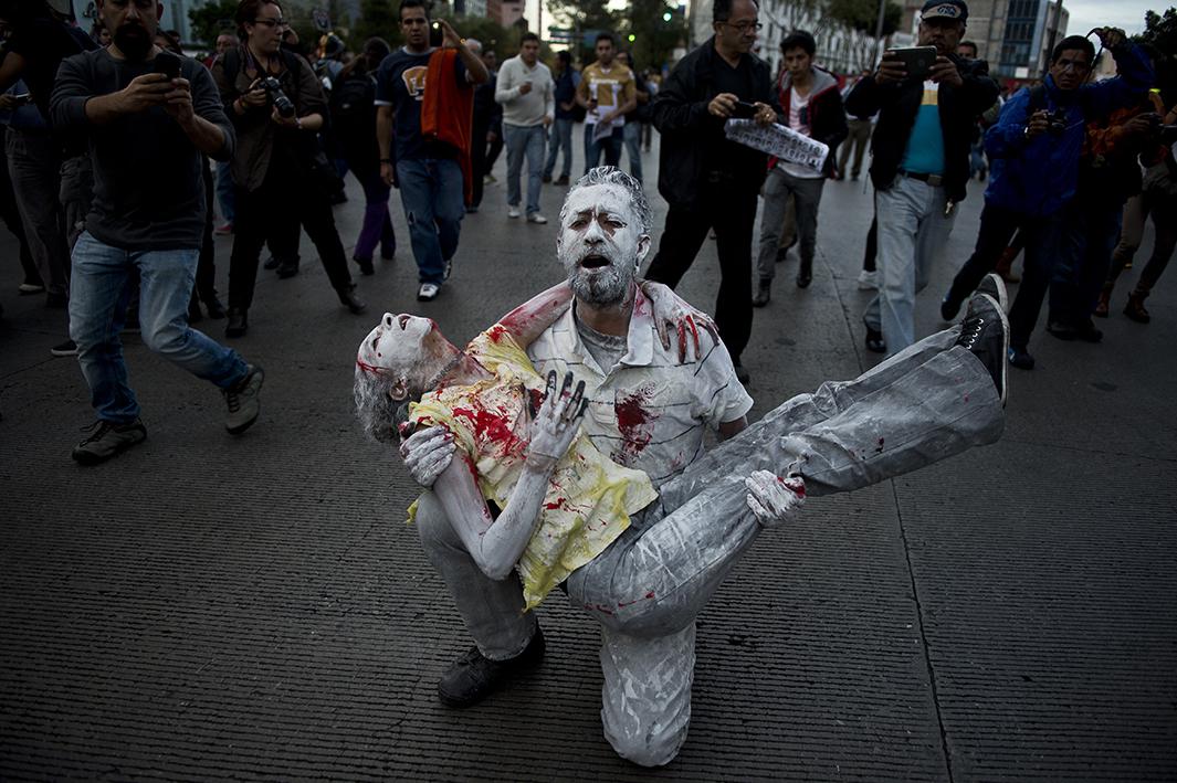 People take part in a march in Mexico City demanding justice for the 43 missing students on October 22. 