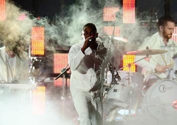 Singer Kendrick Lamar performs together with Imagine Dragons during the 56th Grammy Awards in Los Angeles, California, January 26, 2014.