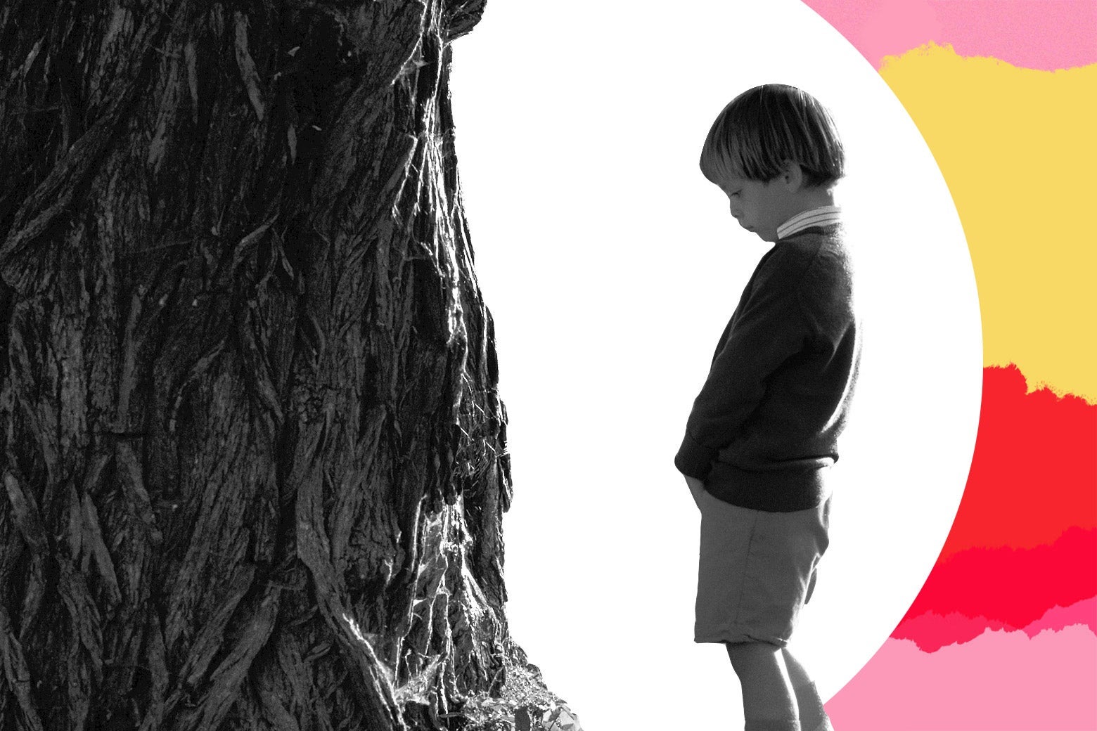 A boy about to urinate on a tree.