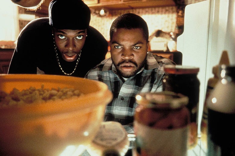 Chris Tucker and Ice Cube look into a fridge.