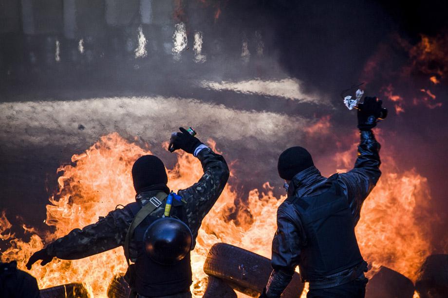 Demonstrators clash with riot police in central Kiev on Feb. 18, 2014. 