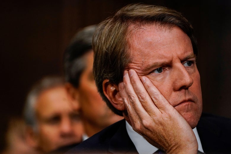 White House counsel Donald McGahn looks on as Supreme court nominee Brett Kavanaugh testifies. 