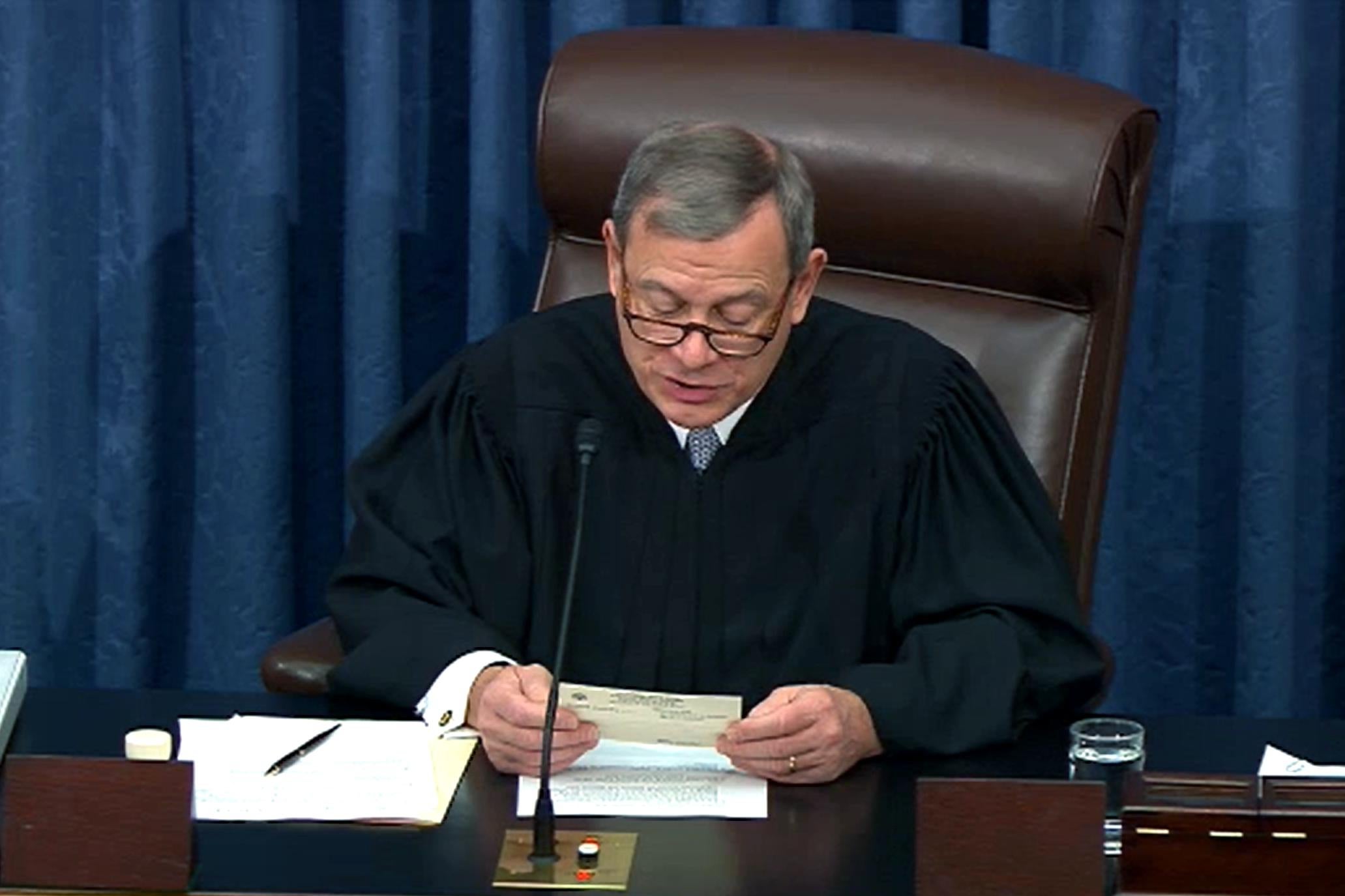John Roberts reads a question from the chair of the Senate.