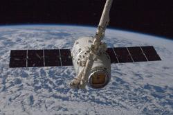 Dragon grappled by the ISS
