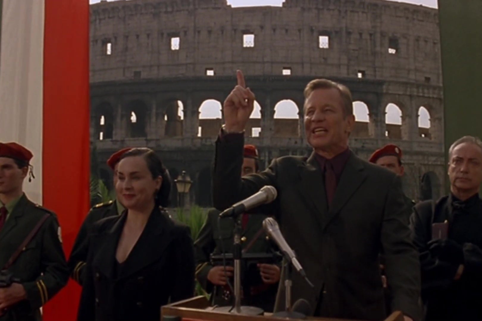 Michael York, as the antichrist, gives a speech in front of the Roman coliseum. 