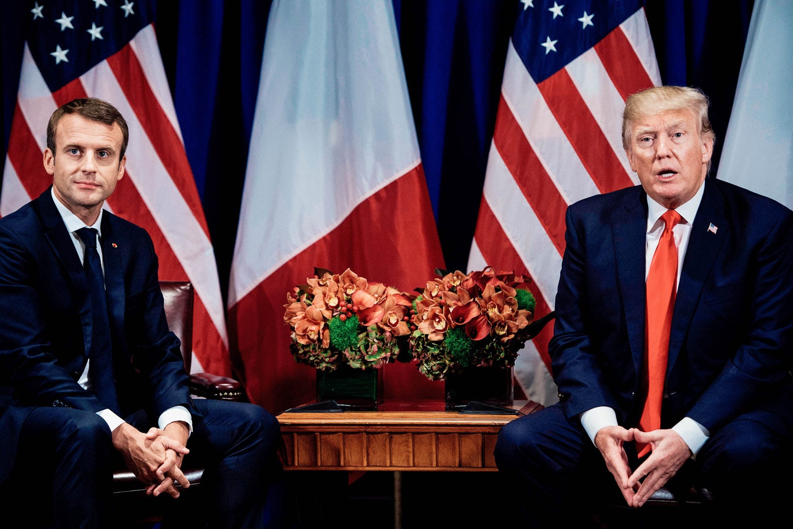French President Emmanuel Macron listens while U.S. President Donald Trump makes a statement for the press before a meeting at the Palace Hotel during the 72nd session of the United Nations General Assembly on Sept. 18 in New York.