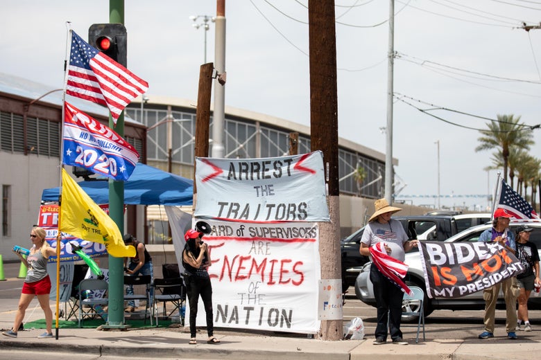 Protesters in support of former President Donald Trump gather outside Veterans Memorial Coliseum where Ballots from the 2020 general election wait to be counted on May 1, 2021 in Phoenix, Arizona. 