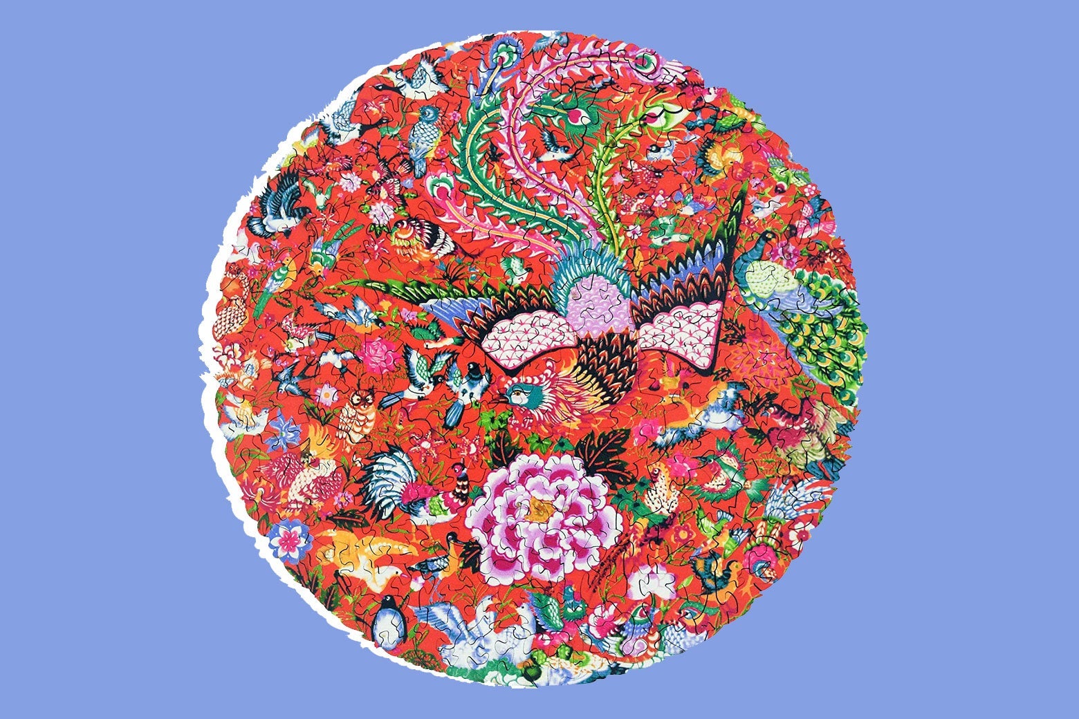 A circular jigsaw puzzle with a flower and phoenix design