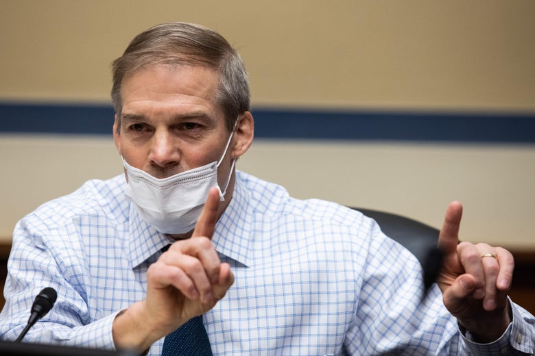 Jim Jordan with his mask below his nose and pointing his fingers