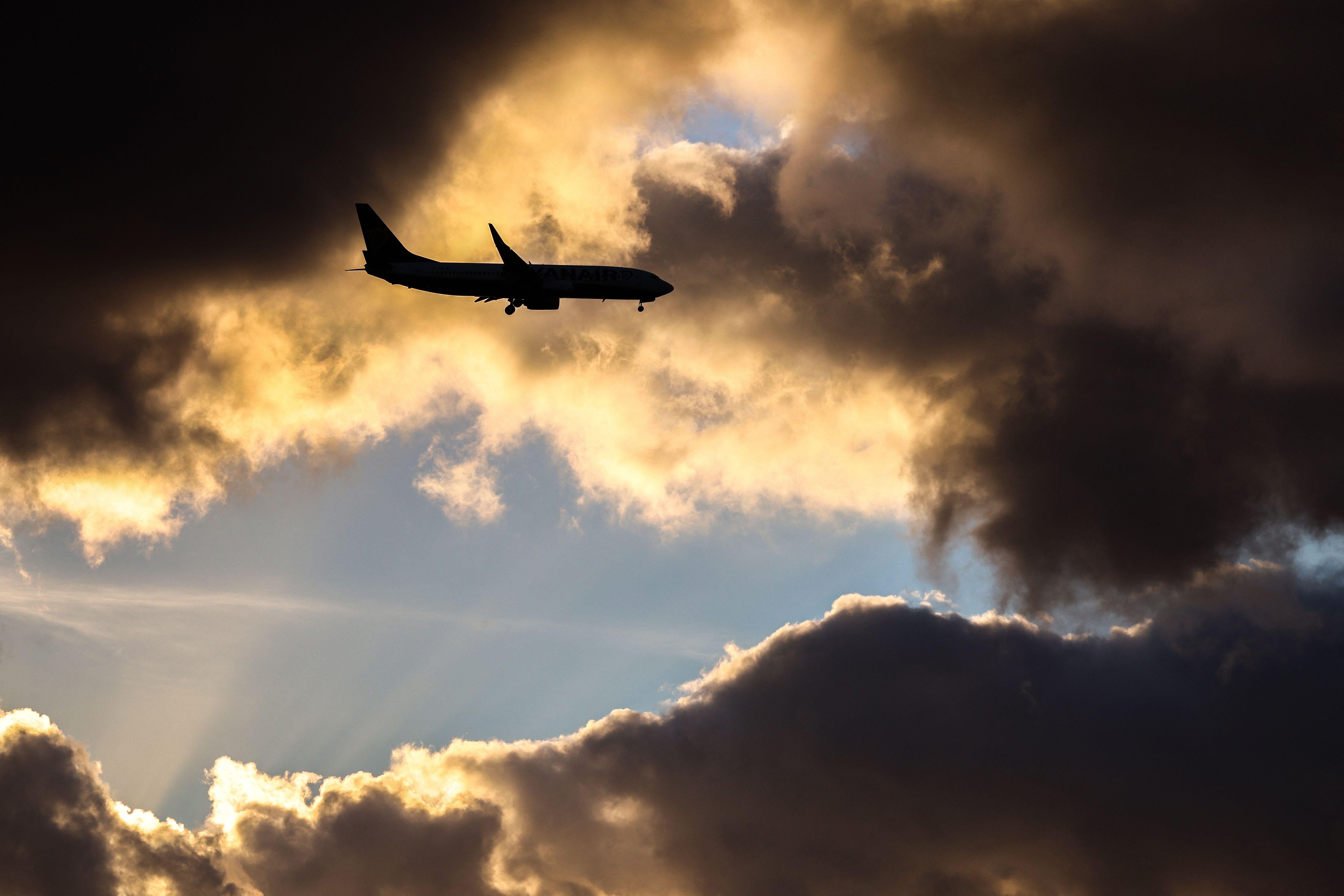 airplanes in the sky at sunset