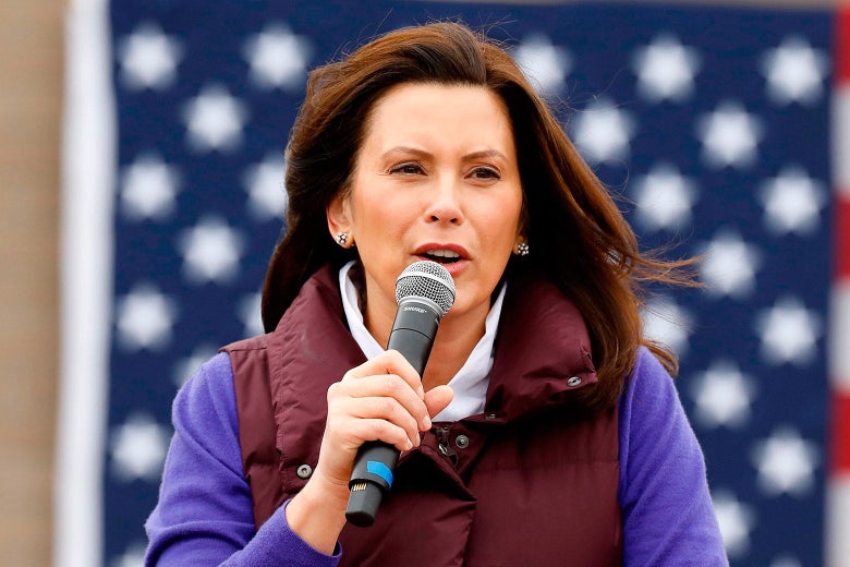 Michigan Gov. Gretchen Whitmer speaking into a microphone at a lectern.