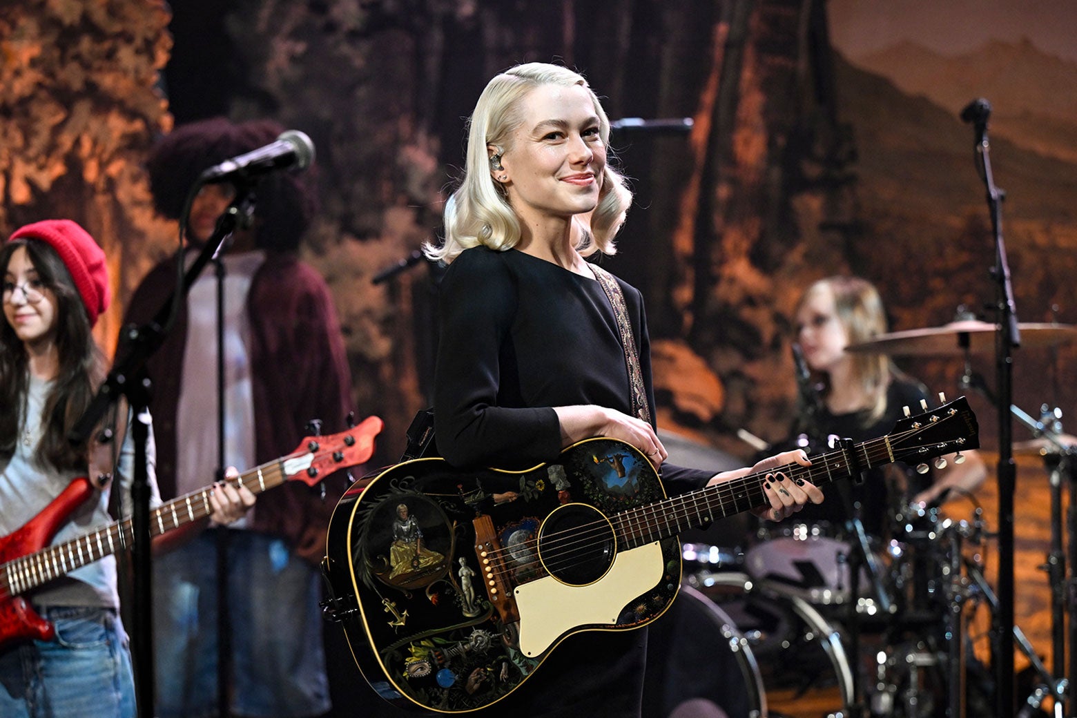 Phoebe Bridgers performing on stage during the Lost Weekend tour, showcasing a change in aesthetic and sound.