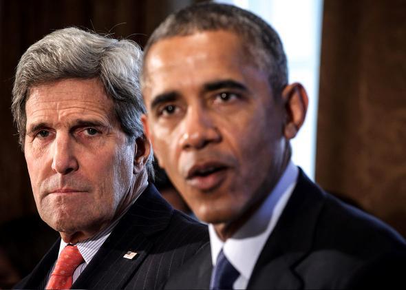 President Barack Obama (R) speaks as State Secretary John Kerry.