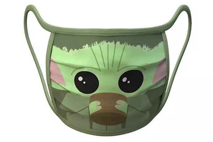 A face mask featuring a cartoonish picture of Baby Yoda drinking from a cup.