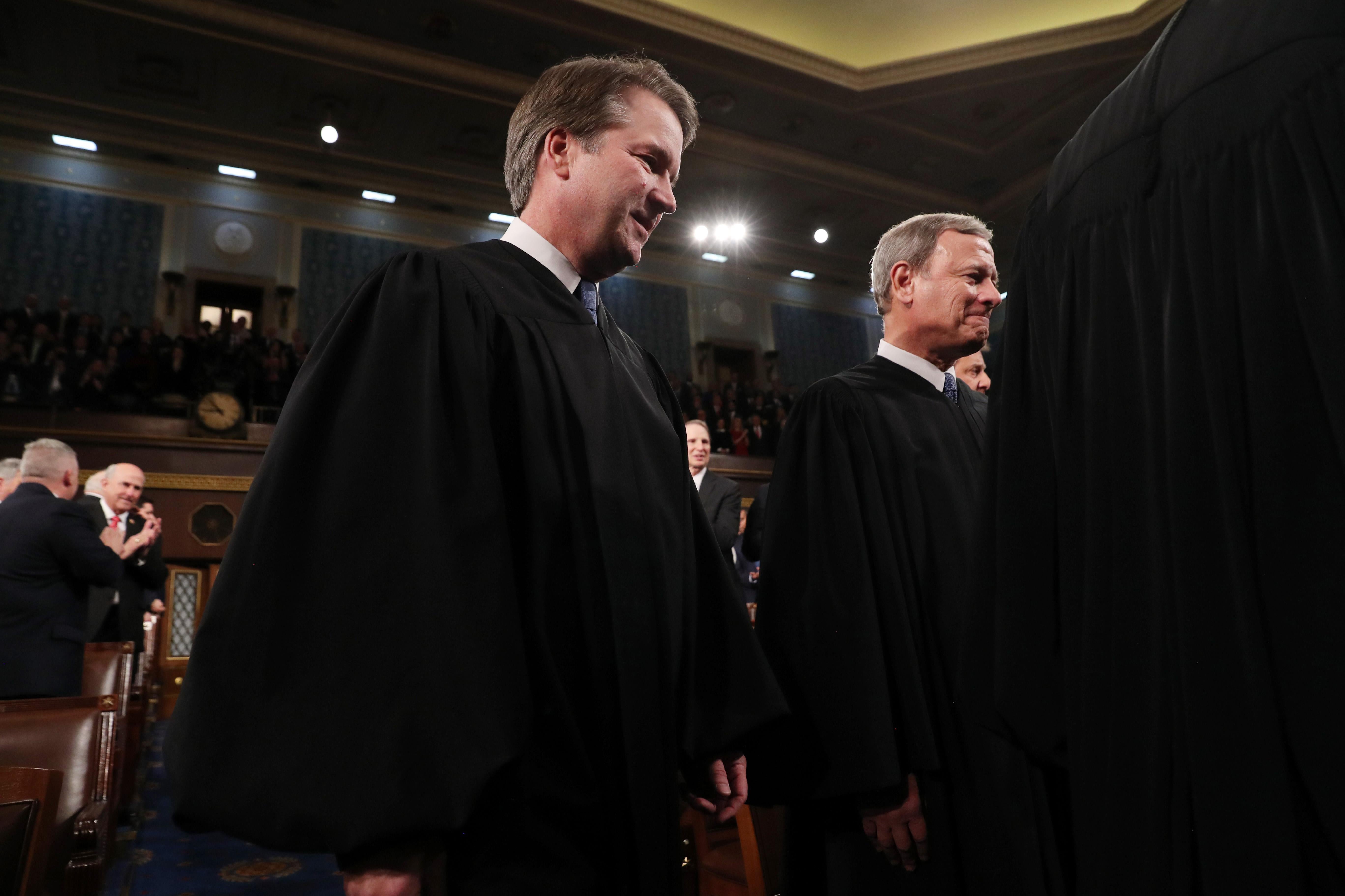 Supreme Court Justice Brett Kavanaugh and Chief Justice John Roberts arrive to hear President Donald Trump deliver the State of the Union address in the House chamber on February 4, 2020 in Washington, D.C.
