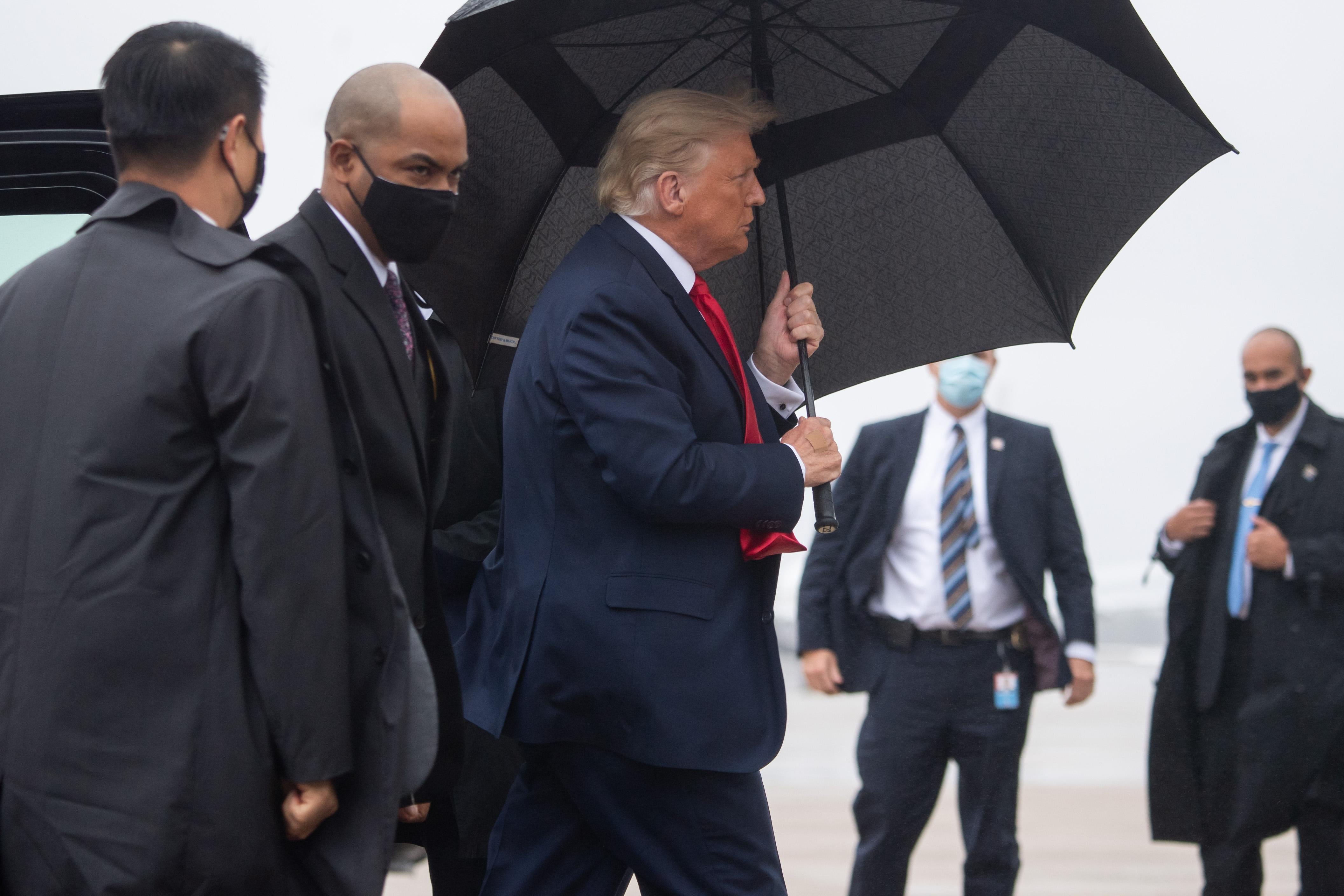 President Donald Trump boards Air Force One prior to departure from Joint Base Andrews in Maryland, October 12, 2020, as he travels to campaign in Florida. 