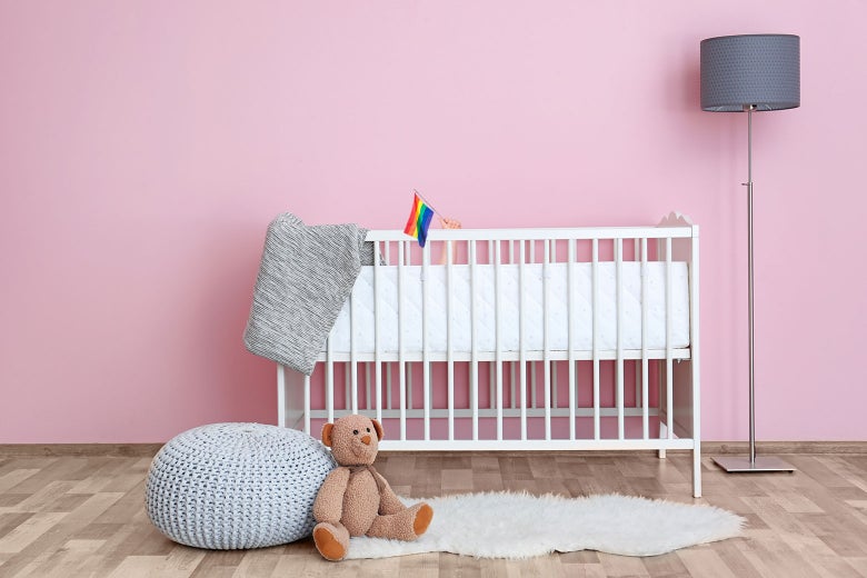 Photo illustration of a baby crib with a little pride flag poking out of it.