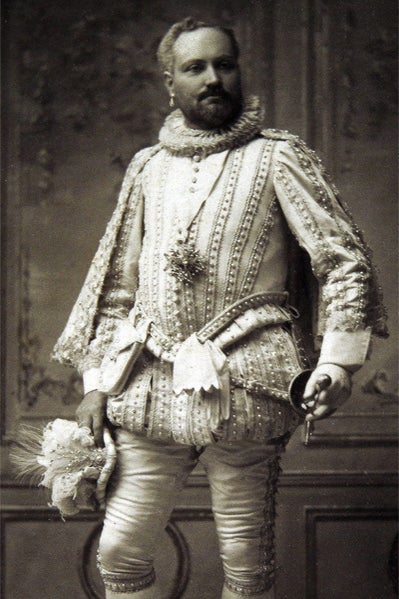 A man in a silver and white costume. 