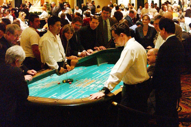 Gamblers play craps at a casino in Vegas