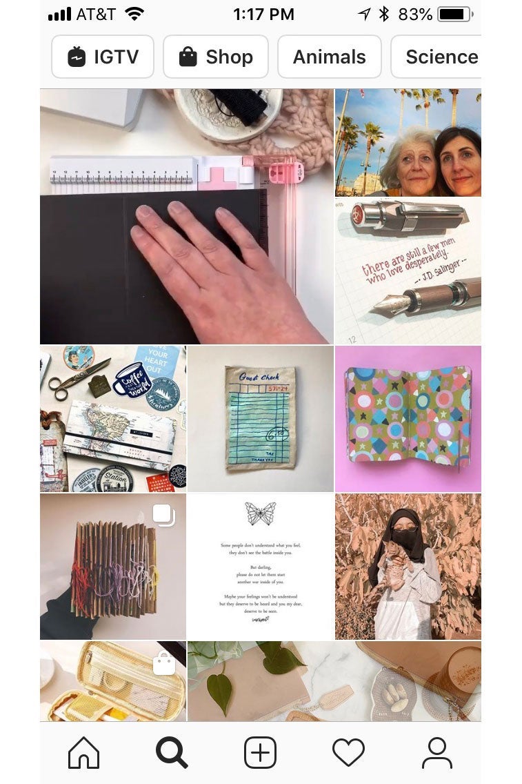 Screenshot of an Instagram Explore feed, featuring photos of pens and paper crafts.