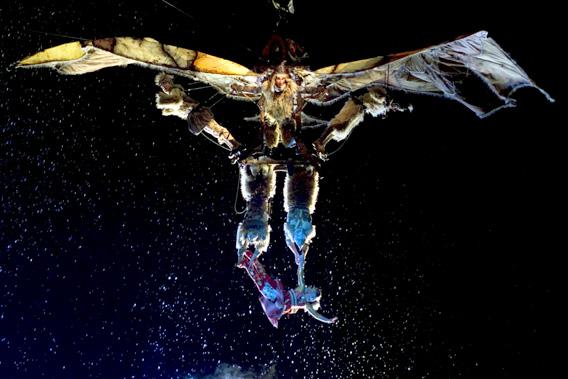 A performer hangs at the bottom of a flying contraption in a scene from the new Cirque du Soleil show "Ka" at the MGM Grand in Las Vegas, Nevada February 2, 2005. 