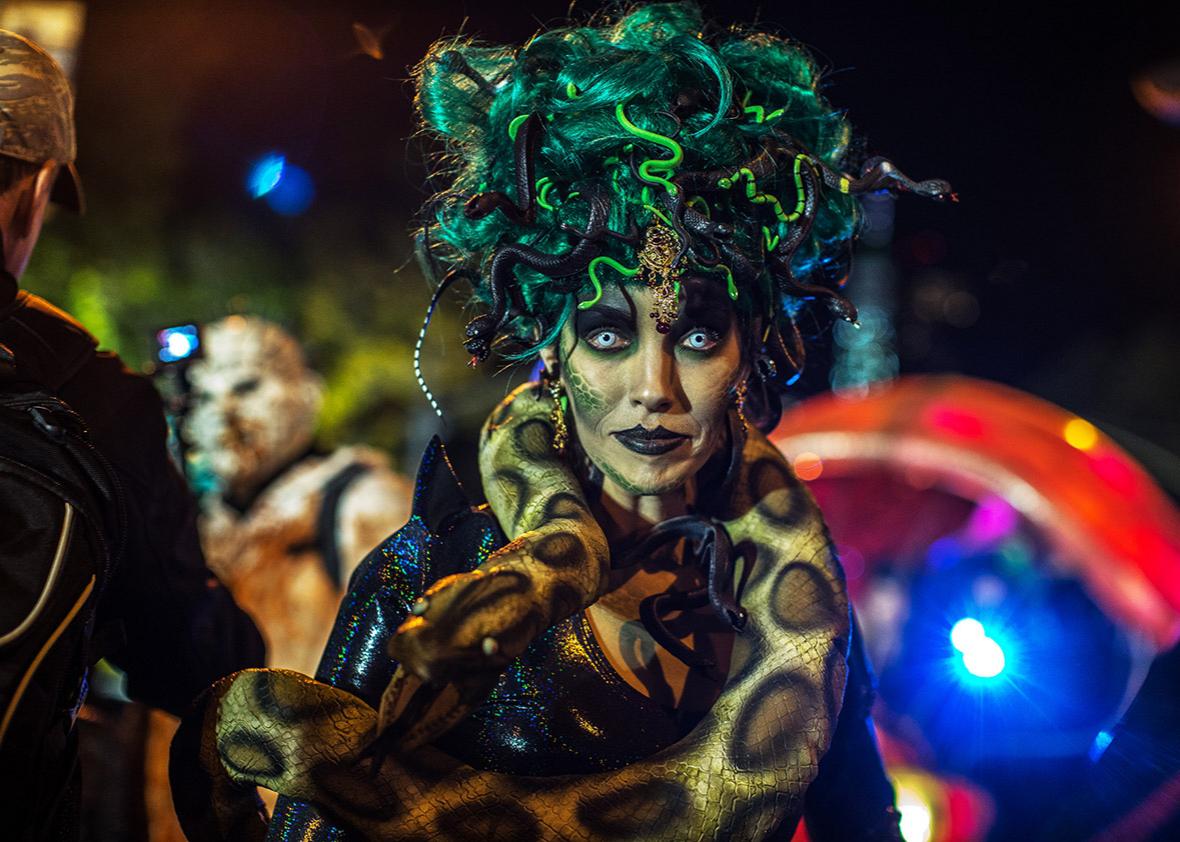 People dressed in Halloween costume take part in Halloween celebrations held within 43rd annual Village Halloween parade October 31, 2016 in New York. 
