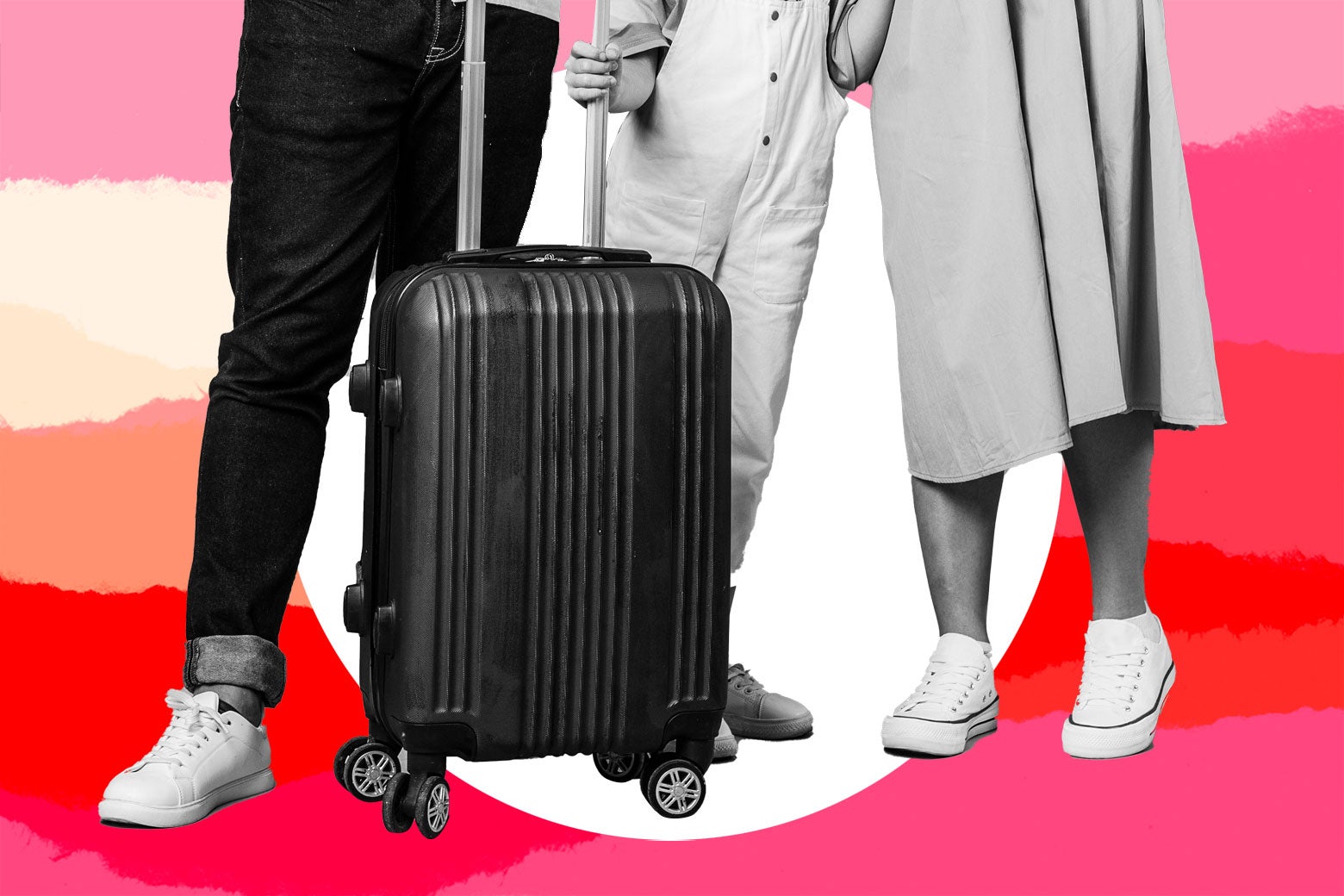 Three people stand next to a suitcase.