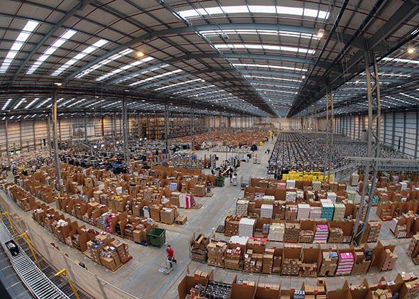 Employees select and dispatch items in the huge Amazon 'fulfillment center' warehouse on November 28, 2013 in Peterborough, England. 
