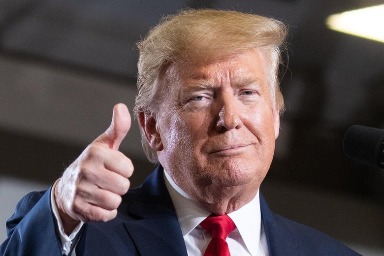 President Donald Trump gives a thumbs-up.