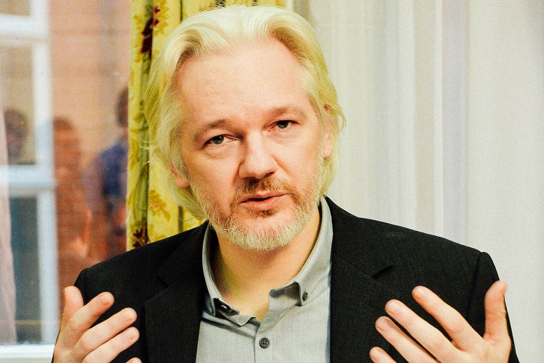 WikiLeaks founder Julian Assange gestures during a 2014 news conference at the Ecuadorian Embassy in London.