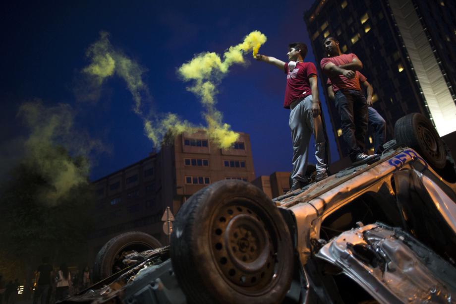 Protesters light torches in Taksim Square on June 4, 2013 in Istanbul, Turkey.