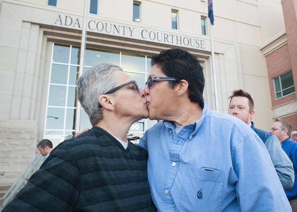 Jody, left, and Maria May-Chang greet as couples gather at the Ada County Courthouse in Boise, Idaho, on Oct. 8, 2014, to apply for same-sex marriage licenses