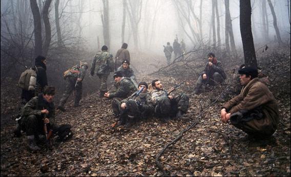 Members of the Chechen army continue to enter Grozny, attempting to retake the city, circa 1999. Here, the soldiers are seen taking a break after a long night on the road.
