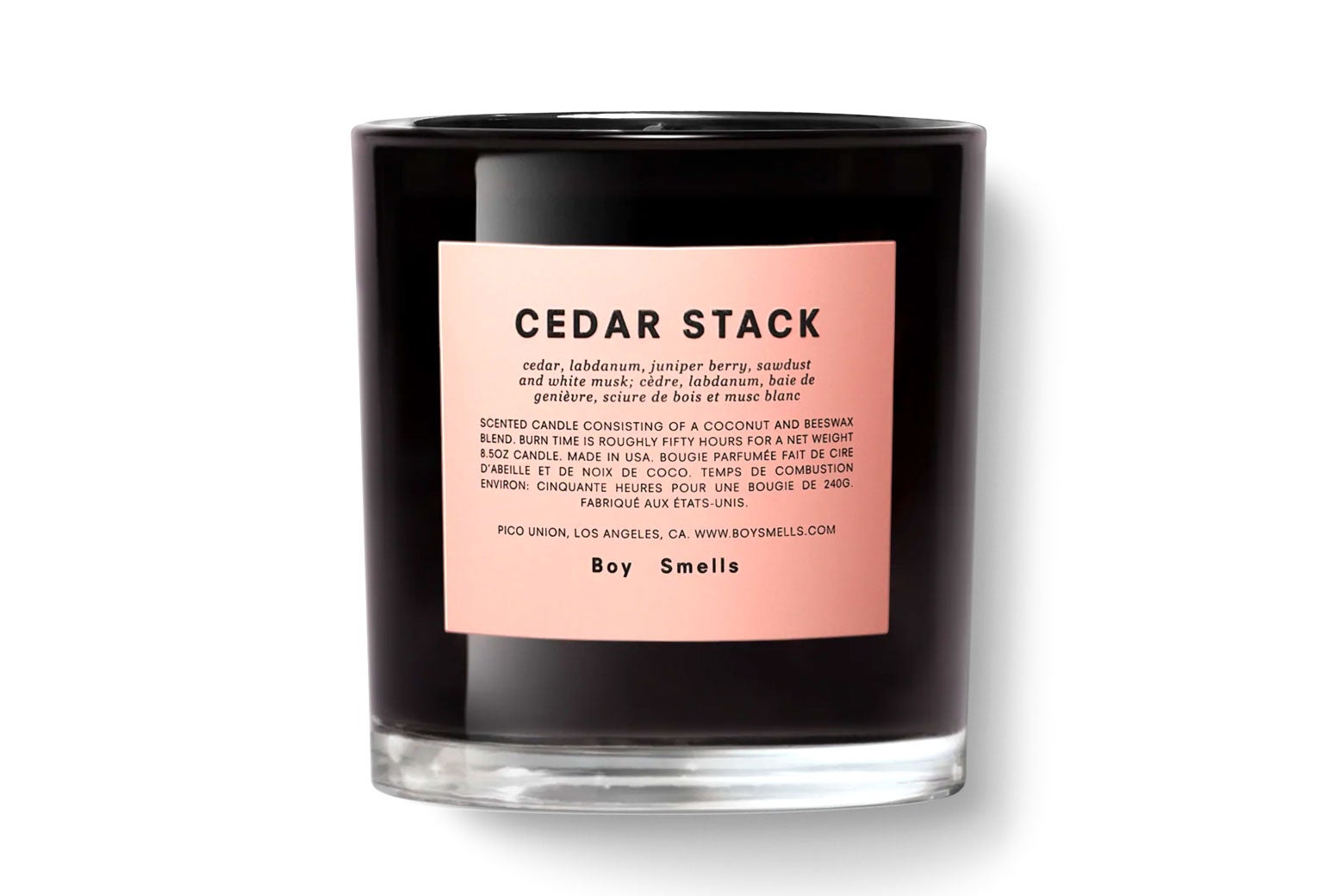 The Cedar Stack candle, a black candle with a pink label, from Boy Smells.