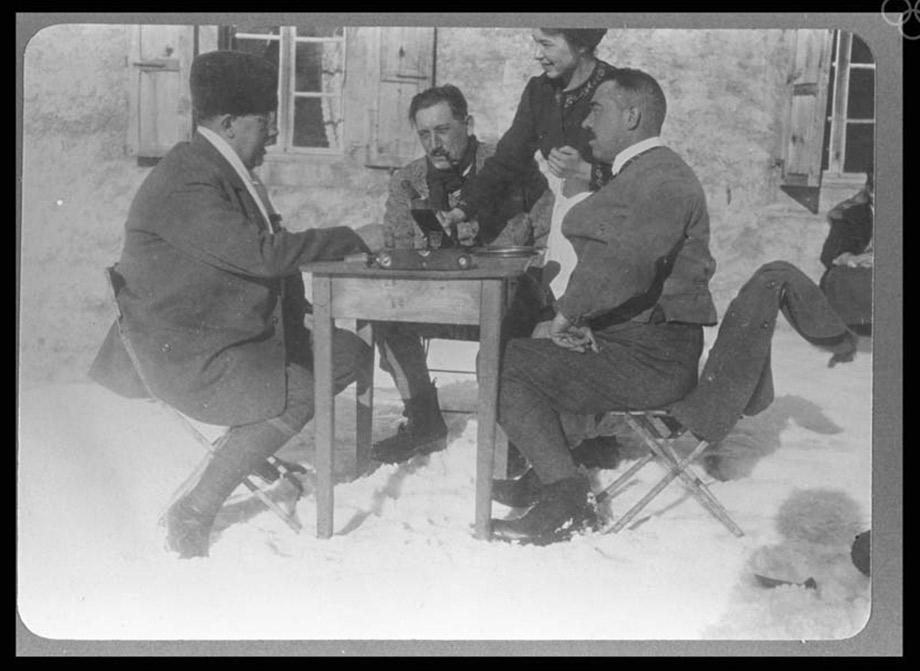 Three members of the Swedish curling team taking a break to have a drink.