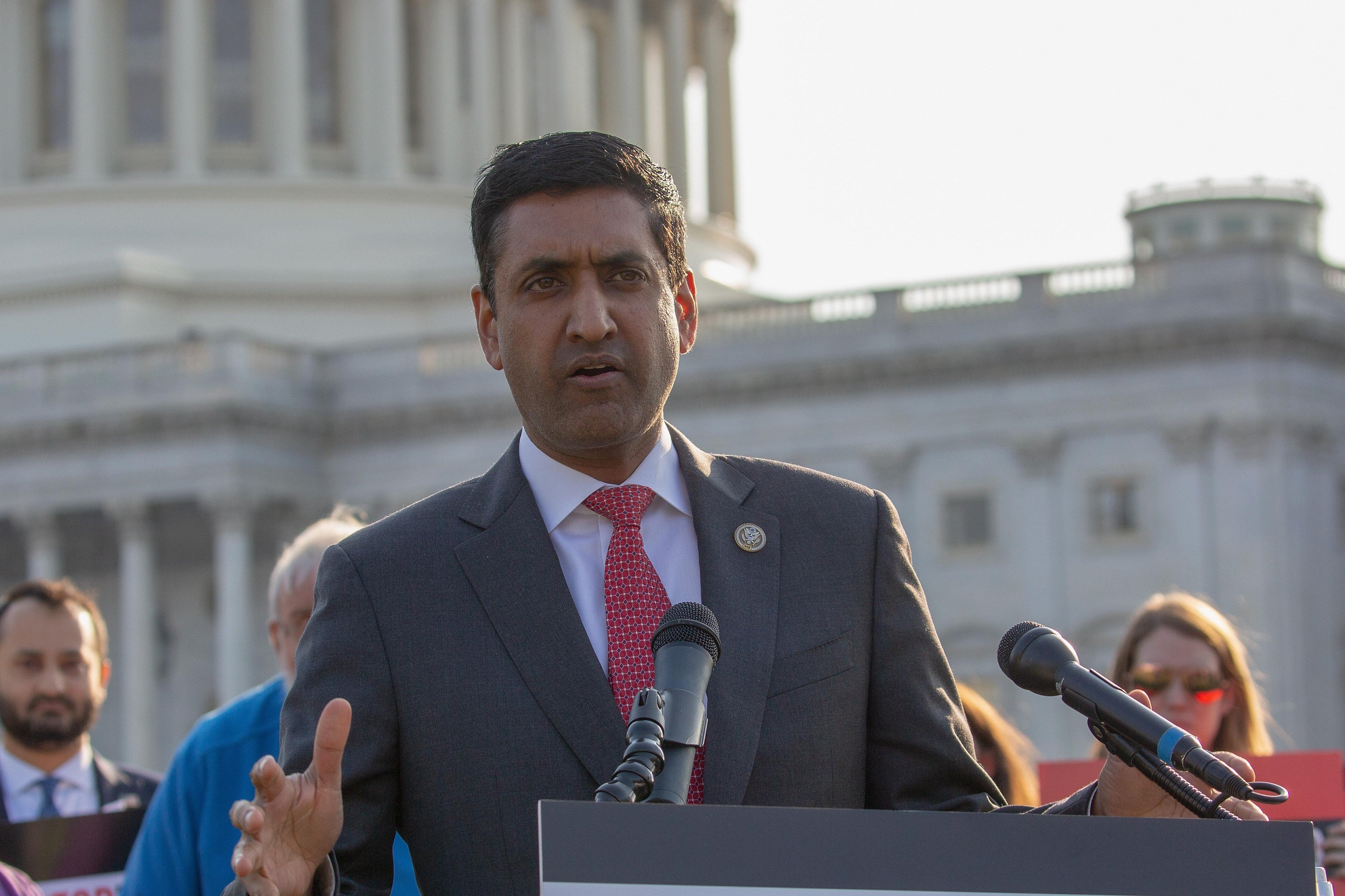Ro Khanna at a lectern before the U.S. Capitol building