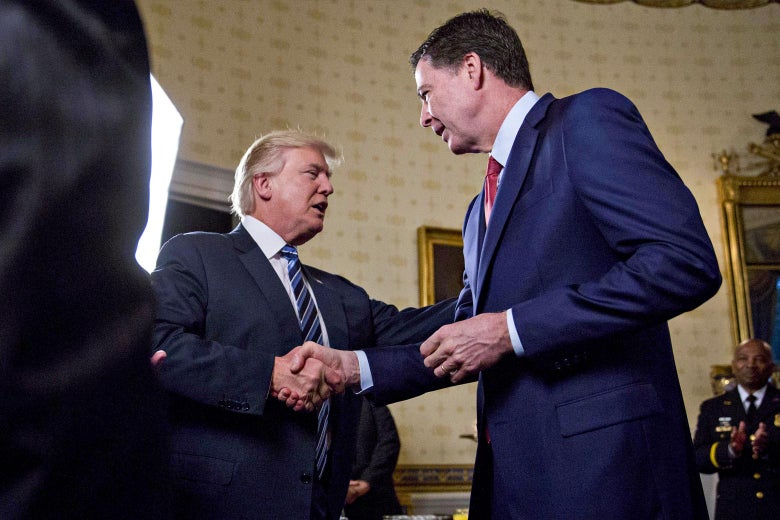 President Donald Trump shakes hands with then–FBI Director James Comey on Jan. 22, 2017.