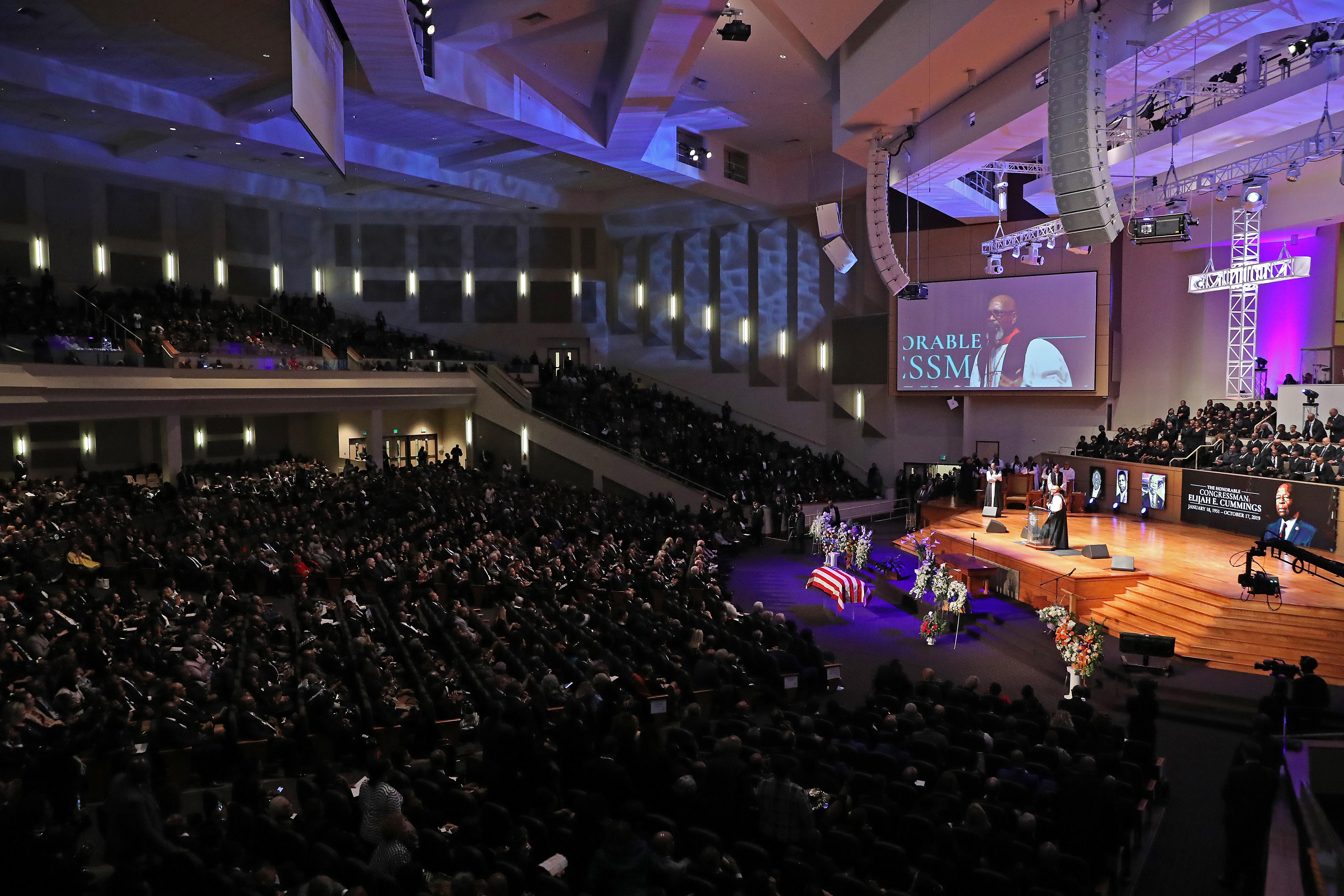 Bishop Walter Thomas, standing in front of a full-crowd, delivers the eulogy during the funeral service for Rep. Elijah Cummings.