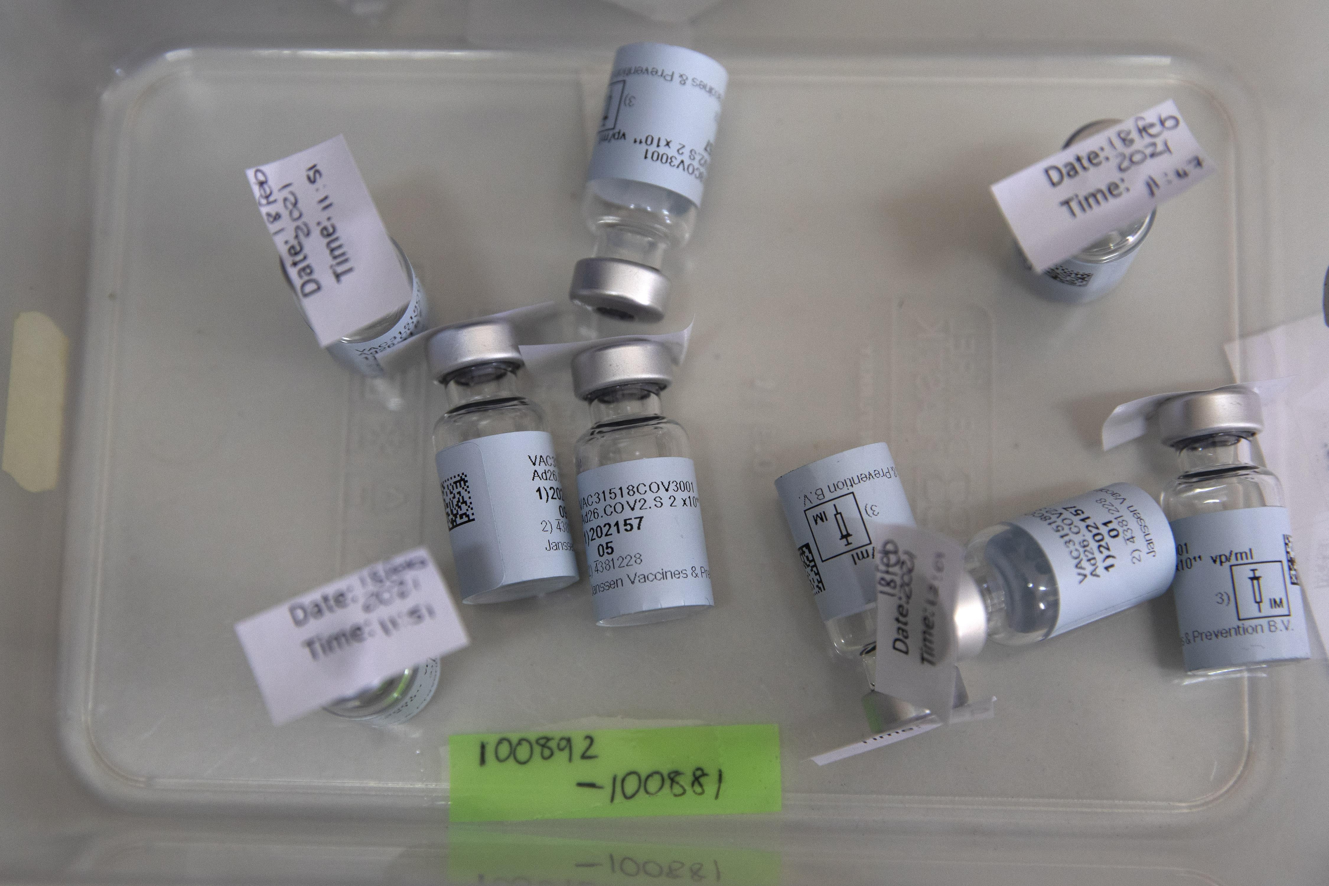 Empty vials that contained a dose of the Johnson & Johnson vaccine against the COVID-19 coronavirus lie on a table as South Africa proceeds with its inoculation campaign at the Klerksdorp Hospital on February 18, 2021. 